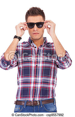 man-putting-sunglasses-on-stock-photo_csp9557992